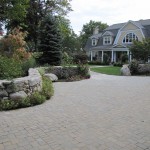 Masonry - stone driveway with meandering stonewall